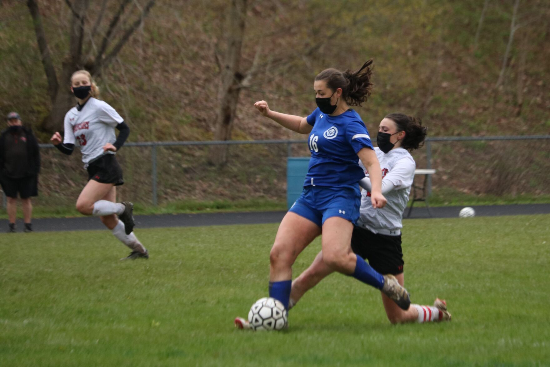 kayla mcgrath kicks the ball